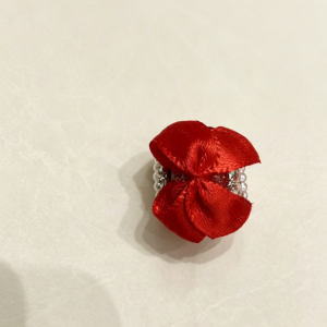 Red bow bead